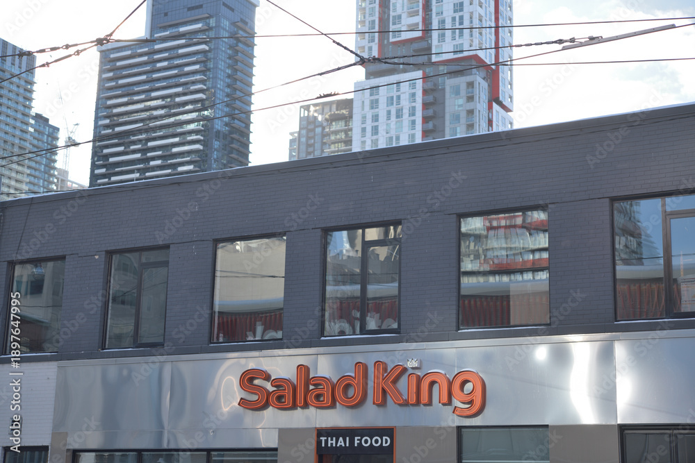 Fototapeta premium exterior of Salad King, a Thai restaurant, located at 224 Queen St W, Toronto