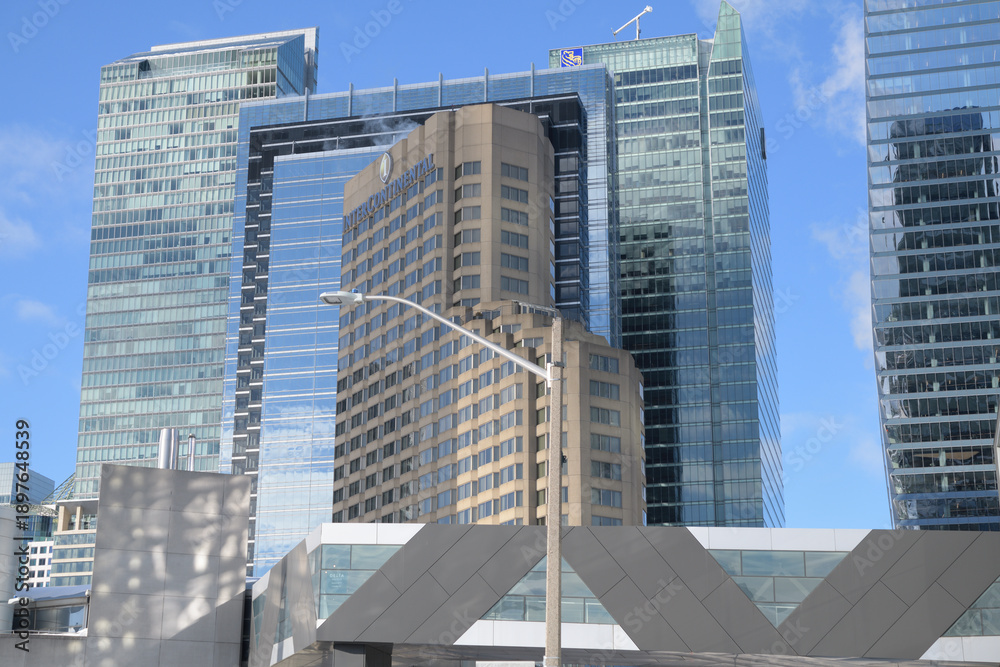 Fototapeta premium pedestrian foot bridge and buildings incl Intercontinental hotel and other business and residential towers, viewed from Lower Simcoe St and Bremner Blvd, Toronto
