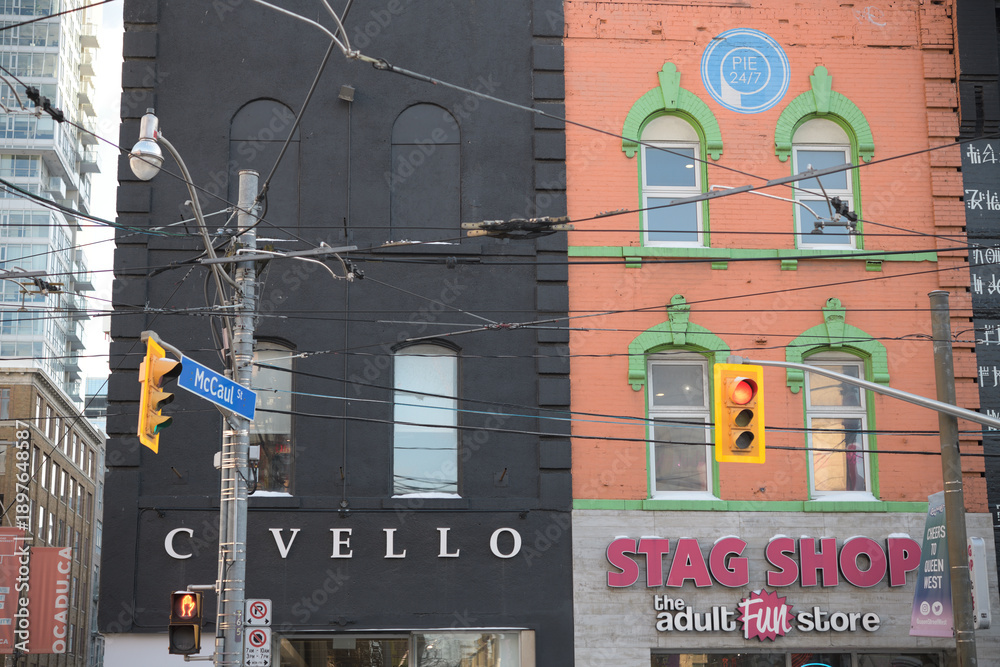 Fototapeta premium exterior building facade and sign of Civello and Stag Shop at 269 and 271 Queen St W, Toronto