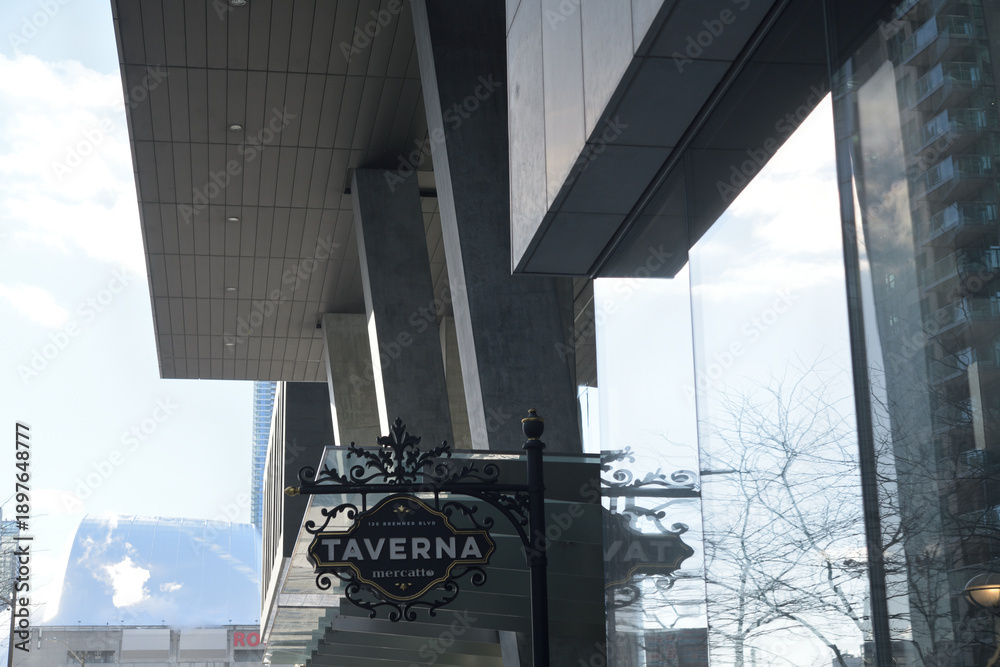 Obraz premium projecting sign outside Taverna Mercatto, an Italian restaurant, located at 120 Bremner Blvd in Southcore Financial Centre, Toronto
