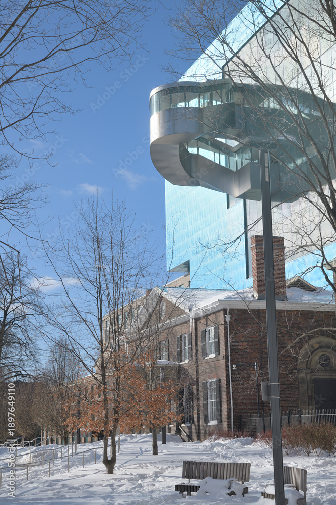 Fototapeta premium Grange House and spiral staircase on the exterior of the Art Gallery of Ontario, viewed from the east side at Grange Park, Toronto
