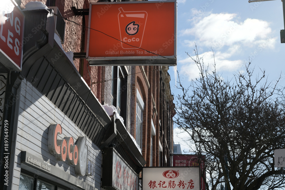 Naklejka premium building facades and sign of CoCo Fresh Tea & Juice located at 371 Spadina Av, Toronto