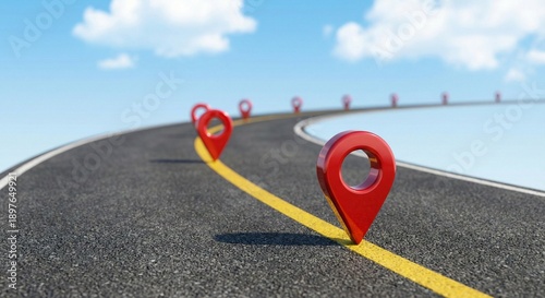 Red glossy location pins along a winding asphalt highway with yellow road markings