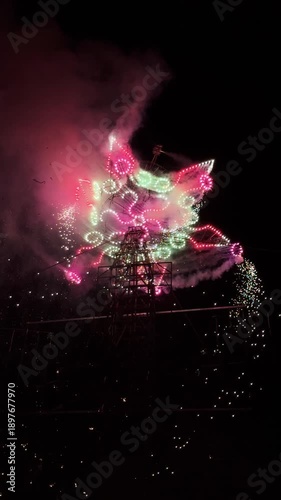Pyrotechnics light show with colorful lights and sparkling fireworks, opening flower