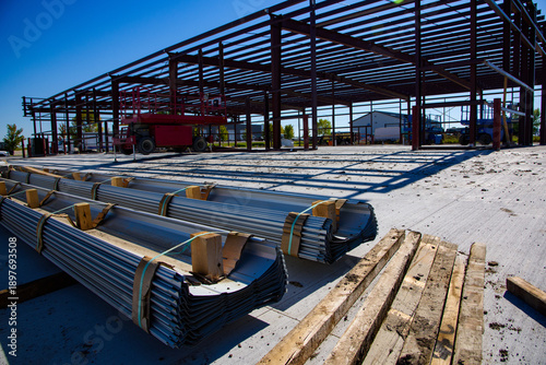 Construction of new commercial building with material in foreground.