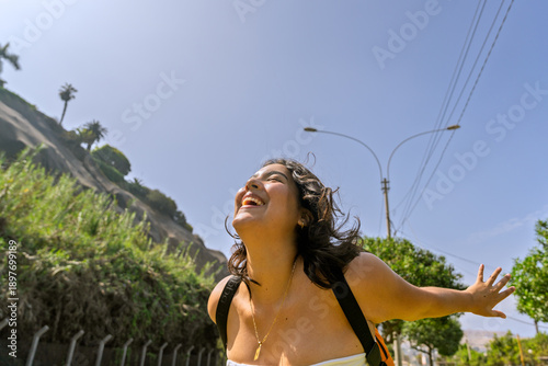 Εκτύπωση καμβά Young latina woman enjoying coastal walk, feeling freedom