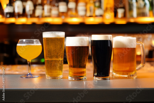 Quadro su tela Assorted beer glasses lined up on a bar counter
Beer tasting selection with diff