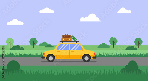 Yellow car driving on a road with luggage on the roof in a green landscape.