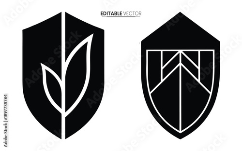 Two black shield emblems with unique white line designs one featuring a leaf motif