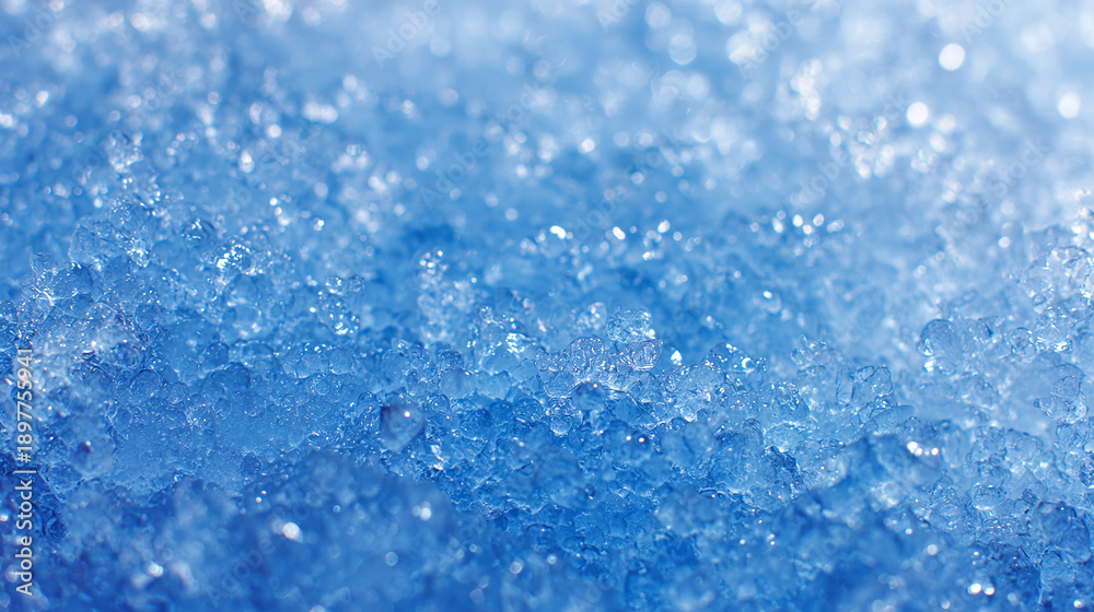 Obraz premium A close-up photograph capturing the textured details of fresh, glistening ice crystals. It showcases a stunning display of icy formations and subtle hues of blue