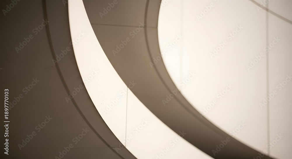 Obraz premium Captivating interplay of light and shadow on gracefully curved architectural forms, creating a minimalist and abstract composition with striking modern design elements