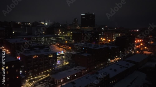 Wallpaper Mural Aerial night view of snow-covered downtown city in United States, with illuminated buildings, streets and rooftops creating calm winter urban atmosphere. Wide shot. Peaceful scene. Torontodigital.ca