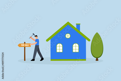 Home for sale, homeowner hammer a sale sign in front of his house.