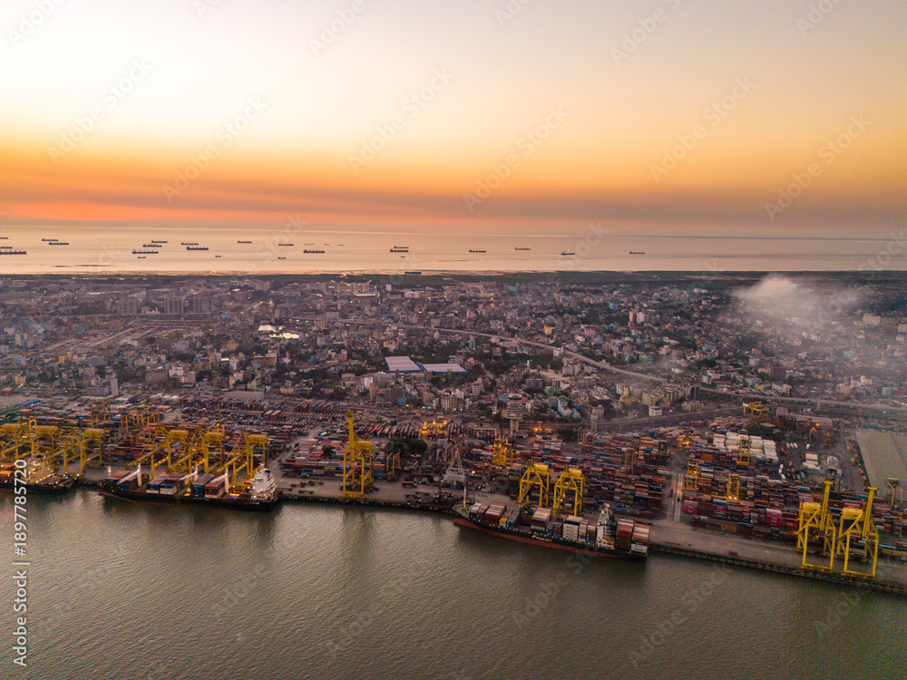 Naklejka premium High-Angle Perspective of Container Shipping Hub in Chattogram, Bangladesh. Busy Container Terminal and Cargo Ships at Chattogram Sea Port, Bangladesh. 