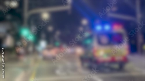 Wallpaper Mural Blurred Ambulance with Flashing Lights Speeding Through City Street at Night Torontodigital.ca