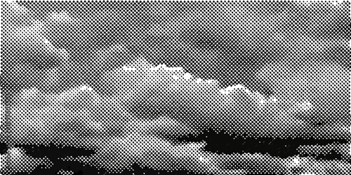 Dramatic grayscale clouds fill the sky creating a textured atmosphere