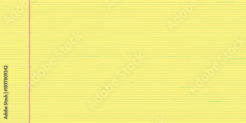 A close up view of lined yellow paper with a red margin