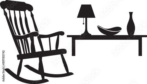 A black silhouette showing a rocking chair table lamp and decorative objects