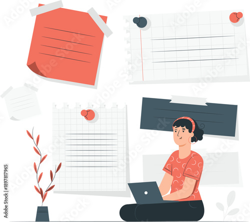 Woman working on laptop surrounded by documents and stationery from an overhead viewpoint