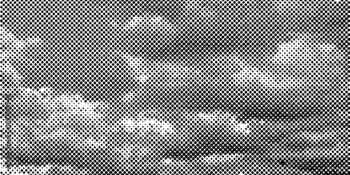 Abstract grayscale image featuring a textured grainy and distorted pattern