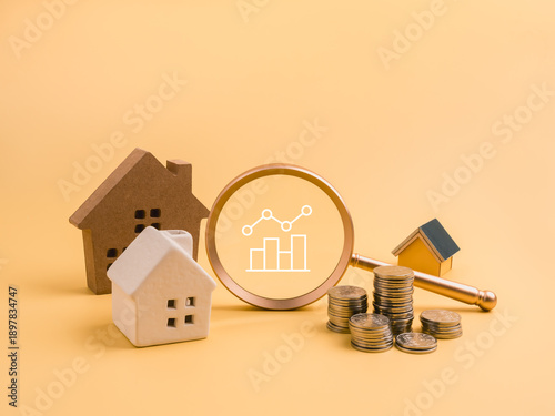Bild auf Leinwand Real estate investment and property analysis concept with various houses, magnifying glass, chart icon, and coins stacks