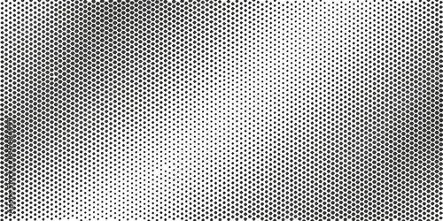 A grayscale halftone pattern with a subtle gradient effect
