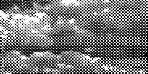 Abstract grayscale image depicting a textured speckled pattern resembling foliage