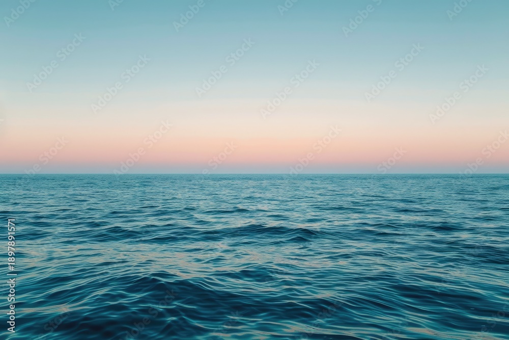 Obraz premium Calm Ocean Water Under Clear Sky at Sunset.