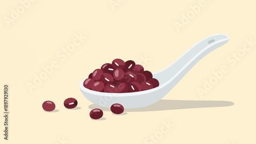 Spoonful of rich red kidney beans on a pale background