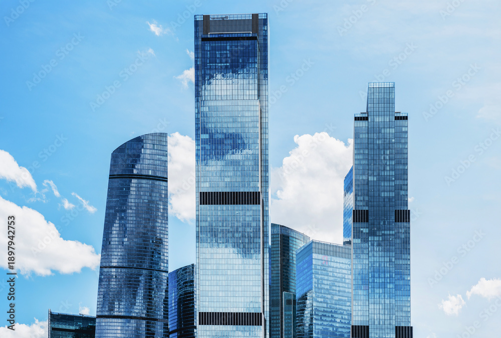 Obraz premium View of modern buildings in Moscow City with blue sky and clouds in the background