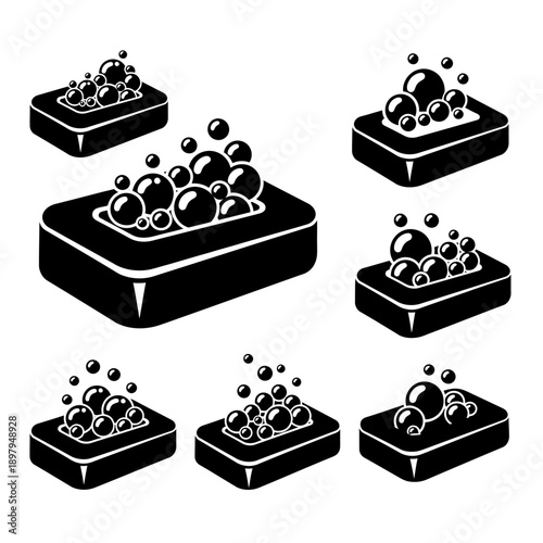 Set of Black Soap Bars with Bubbles and Lather, Isolated on White Background