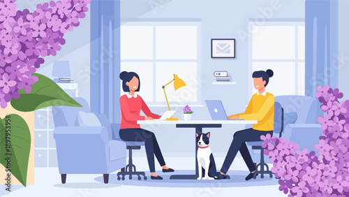 Two people work at a table with a dog, a desk lamp and lilac flowers