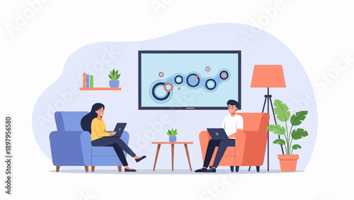 Two people work on laptops in a living room with a large screen