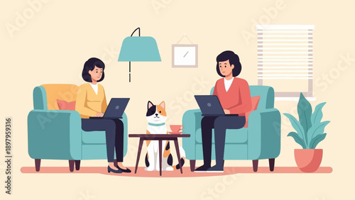 Two people work on laptops in comfortable chairs, with a cat nearby