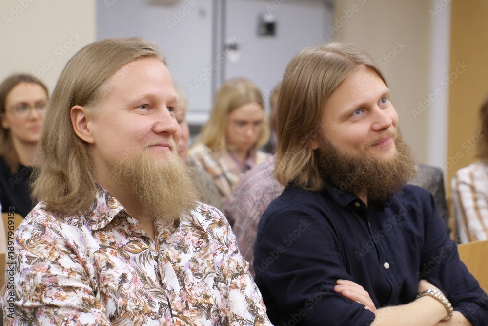Fototapeta premium Men with beards attending lecture in auditorium