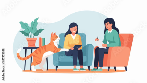 Two women in a living room with a cat, one talking to another on a tablet