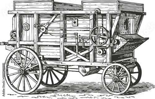 Vintage wooden threshing machine on wheels, agricultural equipment for grain separation