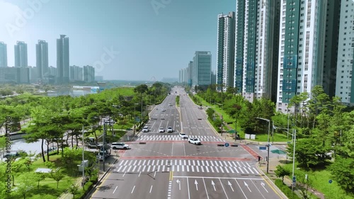 Cars pass by Cheongna-daero near Cheongna Lake Park in Incheon