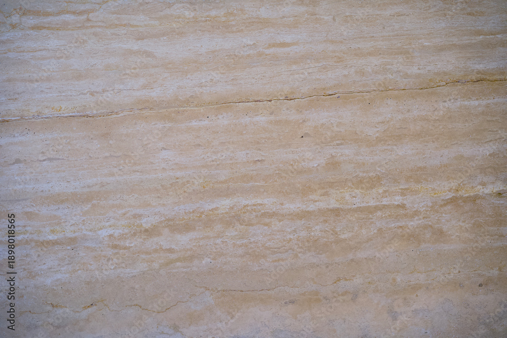 Fototapeta premium Travertine stone surface showing natural beige texture and pattern