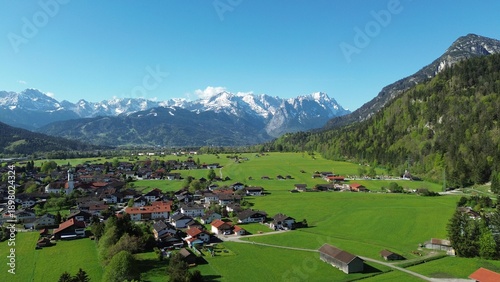 Photos Majestic bavarian alps capped with snow under a dramatic cloudy sky in springtim