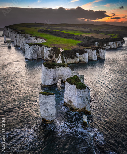 Konstfotografi Studland, Dorset, UK - Aerial vertical view of Old Harry Rocks white cliffs at sunset with dramatic sky
