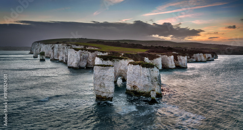 Foto Studland, Dorset, UK - Aerial panoramic view of Old Harry Rocks white cliffs at sunset with dramatic sky