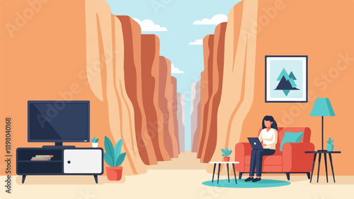 Person working on a laptop on a couch with a canyon view