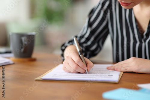 Canvas Print Close up of a self employed hand signing contract