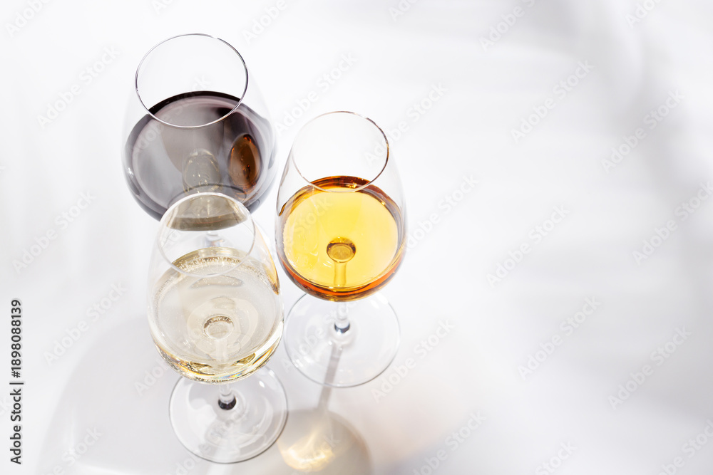 Obraz premium Different wine glasses on white background