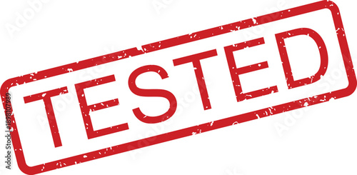 A prominent red rubber stamp mark displays the important word TESTED on a crisp white background