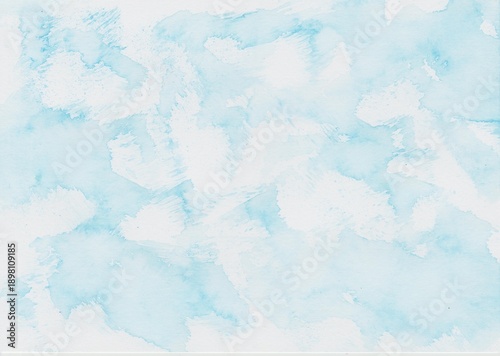 Watercolor background in light blue hand-painted with a sponge