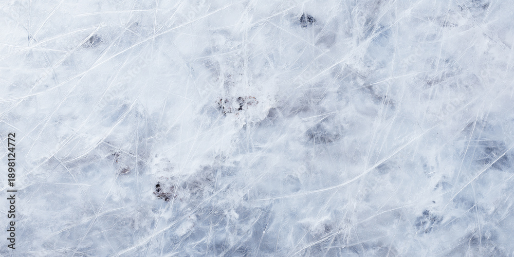 Obraz premium Textured ice surface showing many skate marks and scratches, reflecting the cold of winter and winter sports