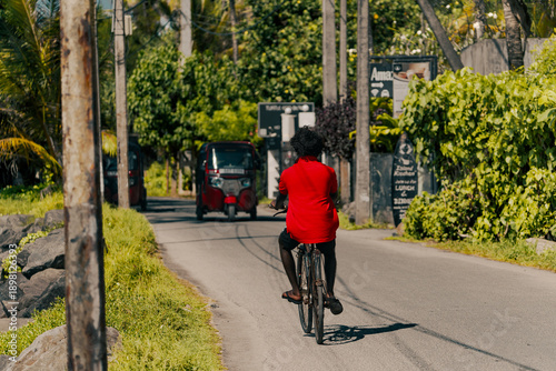 young man riding a bicycle