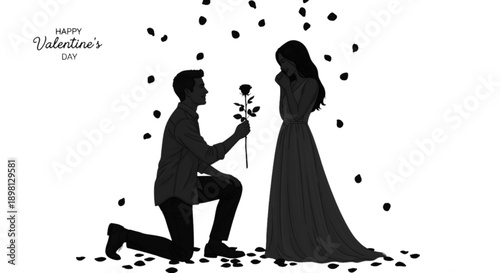 Silhouette of a man proposing to a woman with rose petals falling around them